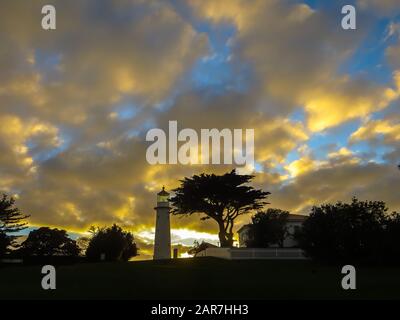 Sunset over the lighthouse on Tiritiri Matangi, New Zealand Stock Photo