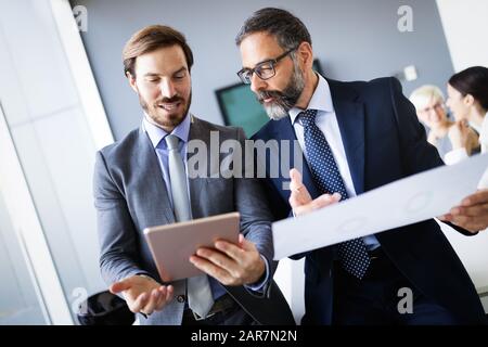 Group of architects and business people working together and brainstorming Stock Photo