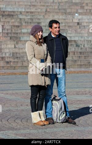 South European tourist couple posing for camera at Senate Square in Helsinki, Finland Stock Photo