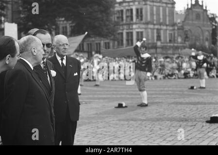 50th anniversary AKU  Prince at flag-waving Annotation: Location: Markt in Arnhem. In the background the Devil House and the old town hall [demolished before 1963] Date: 15 June 1961 Location: Arnhem, Gelderland Keywords: companies, anniversaries, princes Personal name: Bernhard (prince Netherlands) Stock Photo
