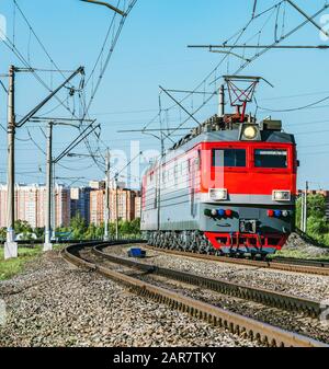 Freight train approaches to the station. Stock Photo