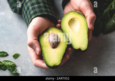 Fresh Cut Avocado With Heart Shaped Pit Area On Wooden Cutting Board  16444609 Stock Photo at Vecteezy