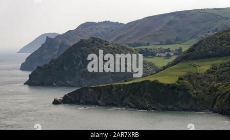 Woody Bay with Crock Point, Duty Point, Castle Rock, Hollerday Hill & Foreland Point, Countisbury in the distance. Viewed from Wringapeak Stock Photo