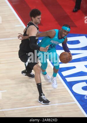 Devonte' Graham of Charlotte Hornets  and   Brook Lopez   of Milwaukee Bucks during the NBA Paris Game 2020 basketball match between Milwaukee Bucks and Charlotte Hornets on January 24, 2020 at AccorHotels Arena in Paris, France - Photo Laurent Lairys / DPPI Stock Photo
