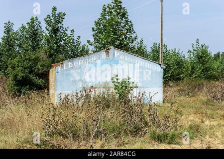 Abandoned shed or hut in overgrown wasteland Stock Photo