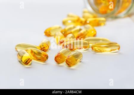 Cod liver oil omega 3 gel capsules on white background. Fish oil vitamins. Stock Photo