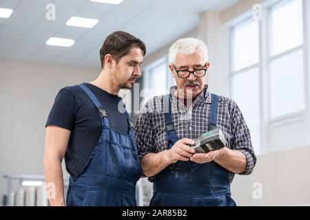Checking remote control Stock Photo