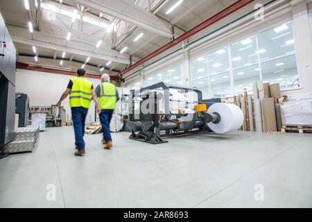 Workers of printing plant Stock Photo