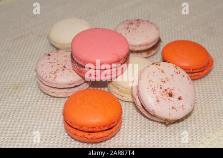 Colorful macaroon biscuits on textile background. Food Stock Photo