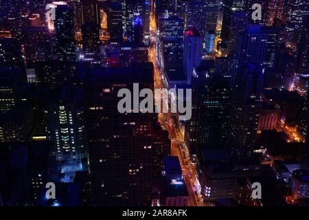 Illuminated at night busy streets of Chicago downtown view from above, Illinois, USA Stock Photo