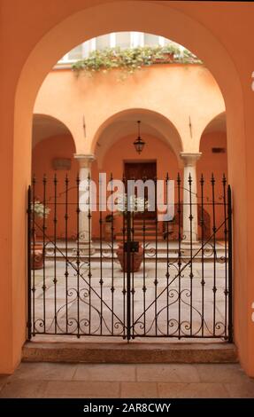 Acqui Terme, tourist walking in search of cityscape and courtyards Stock Photo