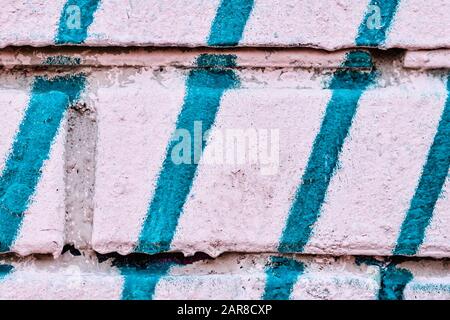 The brick wall is pink and blue lines. Background. Texture. Stock Photo
