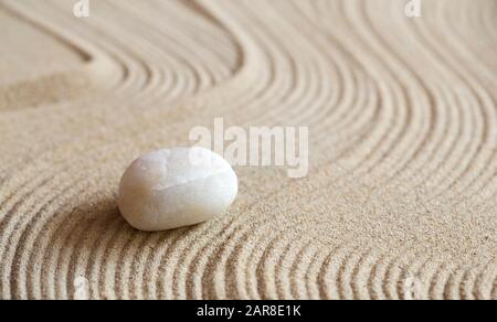 White stone in a zen garden Stock Photo