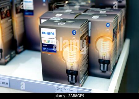 Philips Hue smart lightbulbs on a shelf in a store Stock Photo