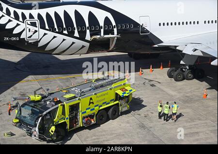 Emergency drill of the airport fire brigade on an ANZ Boeing 777-200 ER, Auckland airport NZ Stock Photo