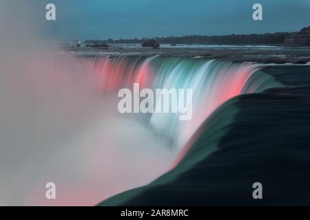 Niagara Falls at night as the famous natural landscape in Canada Stock Photo