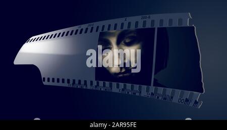 A strip of 35mm film in black and white is seen with the face of a girl in one of the frames. Stock Photo