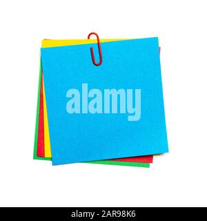 Blue stick note with paper clip isolated Stock Photo