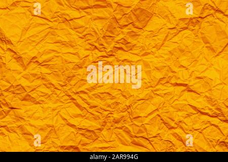 Orange crumpled paper background Stock Photo