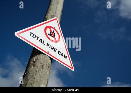 Waitakere ranges, Henderson, Auckland West Coast, Northland, New Zealand Total fire ban fire season white red triangular triangle warning sign Stock Photo