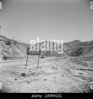 Between Amman and Jerusalem  Road with sign indicating that people are at sea level Annotation: At the time of the recording this place was in Jordan Date: undated Location: Palestine, Jordan, Judea Keywords: mountains, place signs, roads Stock Photo