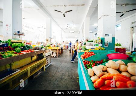 People at the green vegetable market inside in Chetumal, Mexico - december, 2019 Stock Photo