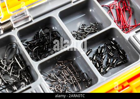 Opened tackle box with fishing hooks and accessories. Fishing hooks in box  sections. Case for tackle elements. Fishing accessories background close-up  Stock Photo - Alamy