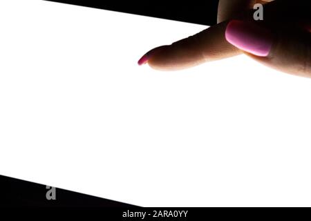Tablet computer mockup in woman hand isolated on black background. Tablet laptop mockup with blank white screen at night. Empty space for text. Copy s Stock Photo