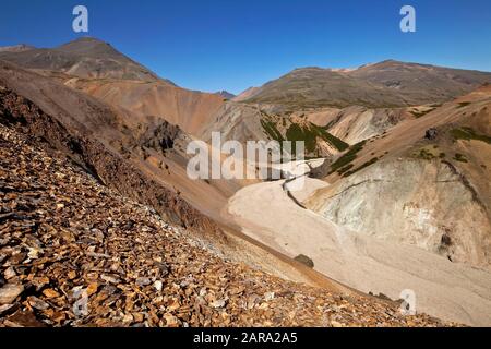 View into a Liparit landscape with barren mountains and river valley, Gulllaugarfjall, Lonsoeraefi, Vatnajoekull National Park, Iceland Stock Photo