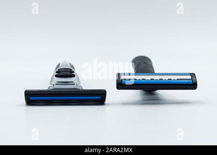 Two razors isolated on a white background. Stock Photo