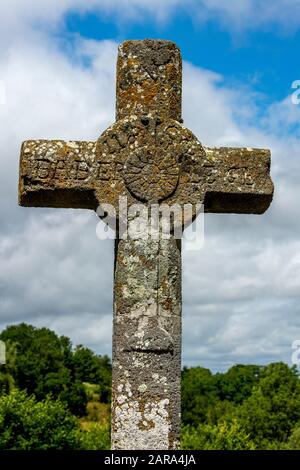 Stone cross in Auvergne Volcanoes Natural Regional Park. Auvergne-Rhone-Alpes. France Stock Photo