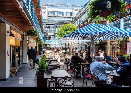 London, UK - May 15, 2019: People enjoying in terrace in Kingly St Court, in Soho near Carnaby Street. Stock Photo