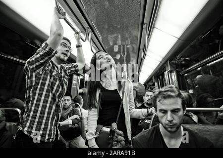 Boy and girl singing, Metro train interior, Paris, France, Europe Stock Photo