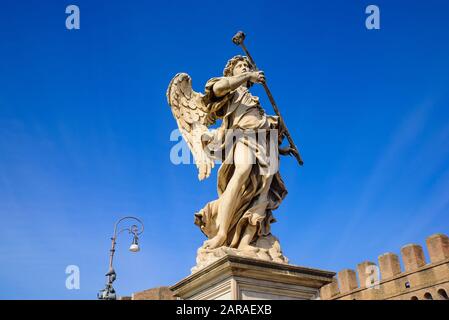 Statue of angel on Ponte Sant'Angelo, a Roman bridge in Rome, Italy Stock Photo