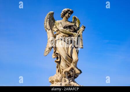 Statue of angel on Ponte Sant'Angelo, a Roman bridge in Rome, Italy Stock Photo