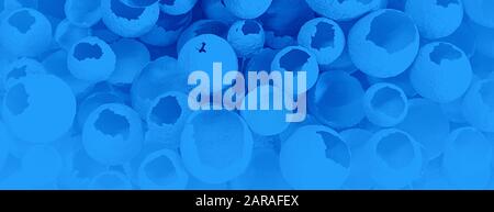 Cracked eggs pattern on classic blue color background. Top view, flat lay, selective focus. Easter creative minimal concept. Classic Blue color of the Year 2020 inscription. Stock Photo