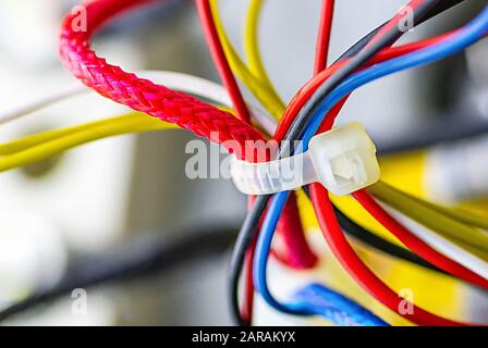Multicolored electrical cables isolated close up. Selective focus. Stock Photo