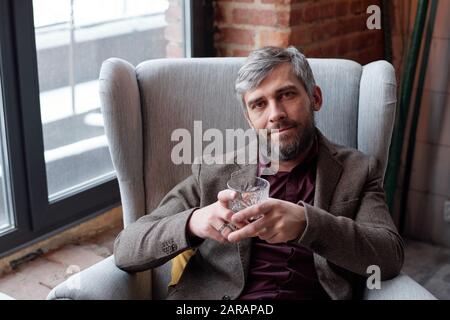 Bearded man with whisky glass Stock Photo