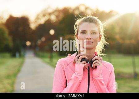 Female athlete during a short break Stock Photo