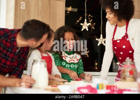 Family baking cookies for Christmas together Stock Photo