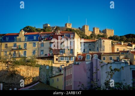 Castelo hilltop neighborhood and the medieval São Jorge Castle in Lisbon, Portugal Stock Photo