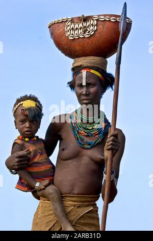 Woman with child, Galeb tribe, Omorate,Omo Valley Region,  Ethiopia Stock Photo