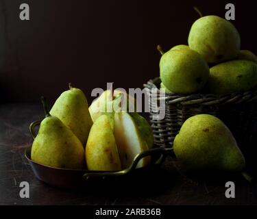 Fresh ripe organic pears on a rustic wooden table Stock Photo