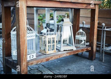 Romantic decor metal bird cages and lanterns. Beautiful wedding. Shby chic style Stock Photo