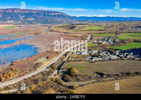 Aerial view of a road and a reservoir. Stock Photo