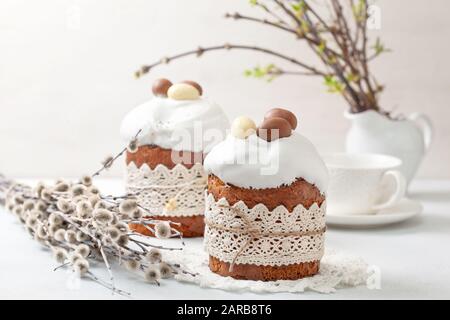 Easter composition with Easter cake (kulich), willow branches on a light background Stock Photo