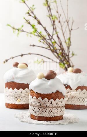 Easter composition with Easter cake (kulich), willow branches on a light background Stock Photo