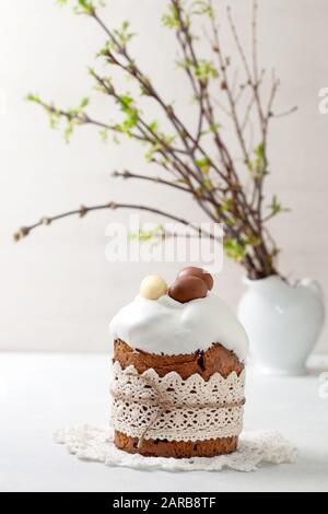 Easter composition with Easter cake (kulich), willow branches on a light background Stock Photo