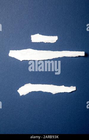 Torn Paper Strips on Blue Stock Photo