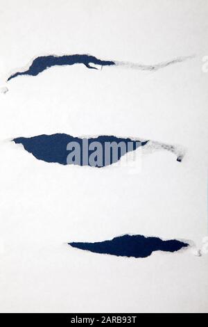 Torn Paper Sheet on Blue Stock Photo
